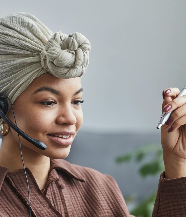People connecting in a virtual meeting, smiling and engaged.